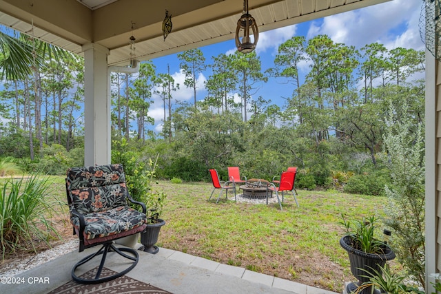 view of yard featuring a patio area and a fire pit