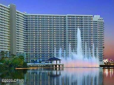 outdoor building at dusk featuring a water view