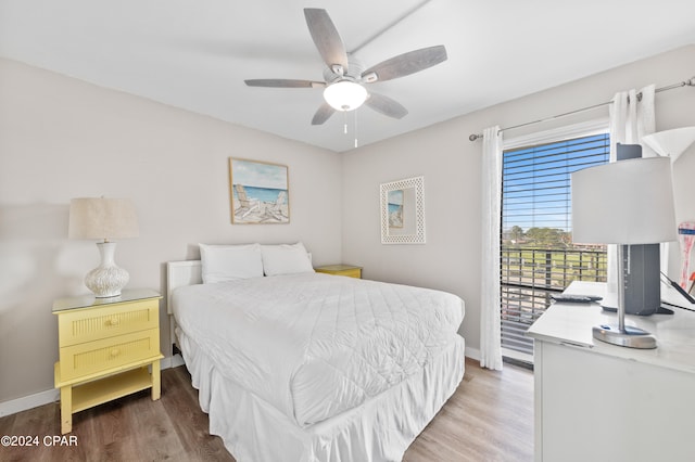 bedroom featuring ceiling fan, hardwood / wood-style flooring, and access to exterior