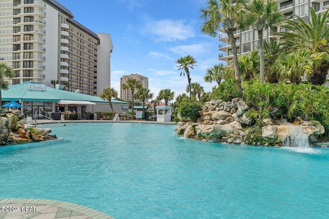 view of pool with pool water feature and a gazebo