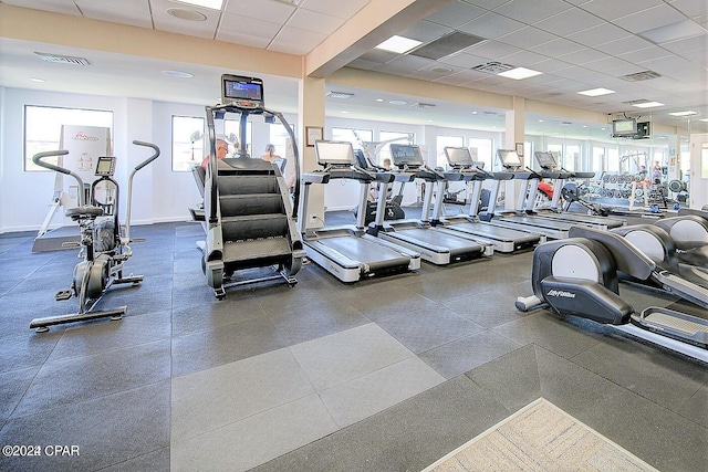 workout area with a paneled ceiling