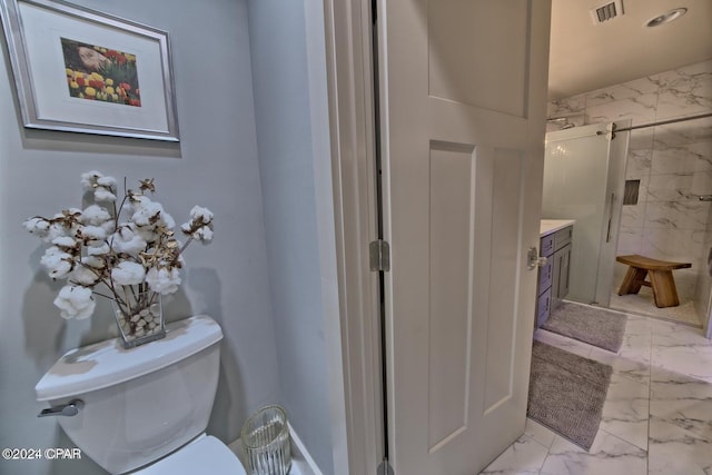 bathroom with a stall shower, visible vents, toilet, marble finish floor, and vanity