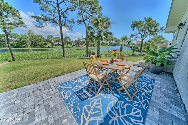 view of patio with a water view