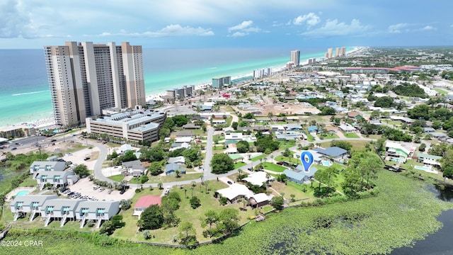 drone / aerial view featuring a view of city and a water view