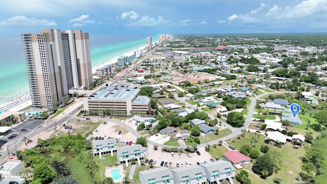 drone / aerial view featuring a view of city and a water view