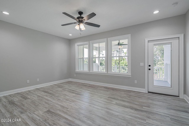 interior space featuring light hardwood / wood-style flooring and ceiling fan