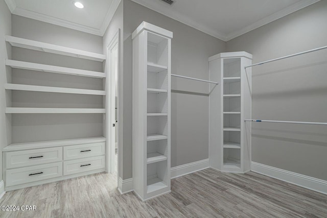 spacious closet featuring light hardwood / wood-style floors