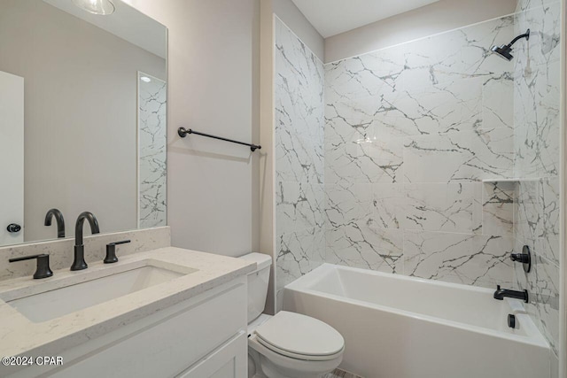 full bathroom with vanity, toilet, and tiled shower / bath