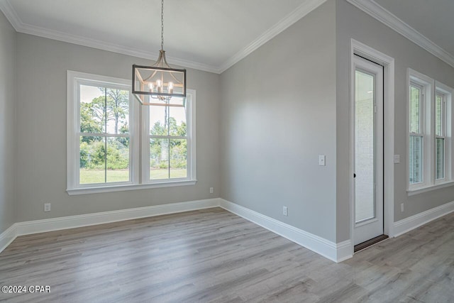 interior space with crown molding, light hardwood / wood-style flooring, and a notable chandelier