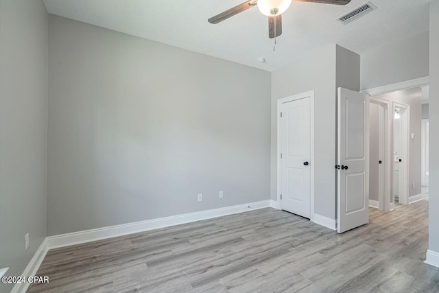 unfurnished bedroom with ceiling fan, a textured ceiling, and light hardwood / wood-style flooring