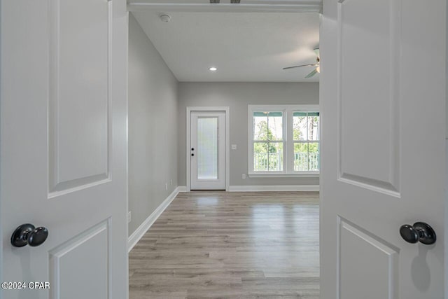 entryway with light hardwood / wood-style floors and ceiling fan