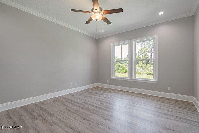 unfurnished room with ornamental molding, light hardwood / wood-style flooring, and ceiling fan