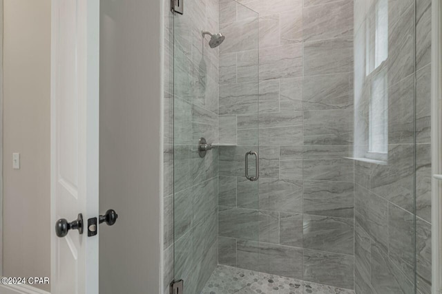 bathroom featuring an enclosed shower