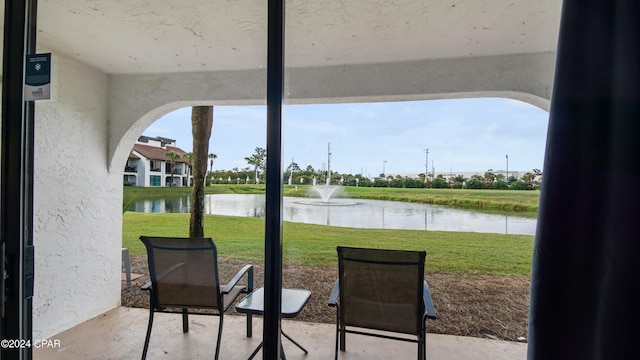 view of patio featuring a water view