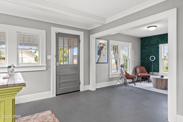 entryway with ornamental molding and dark hardwood / wood-style flooring