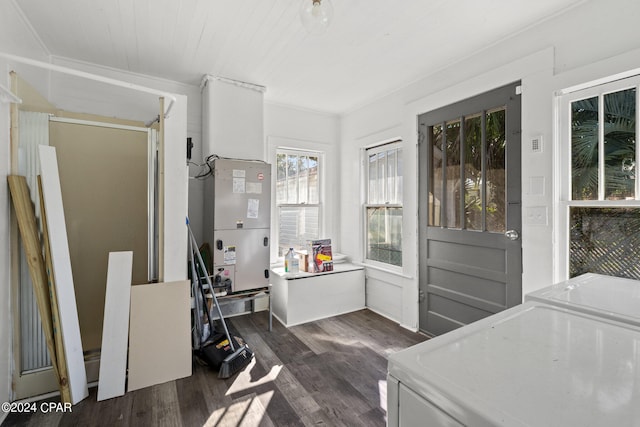 interior space featuring washing machine and dryer and dark hardwood / wood-style flooring