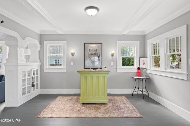 sitting room with dark hardwood / wood-style floors, beamed ceiling, and crown molding