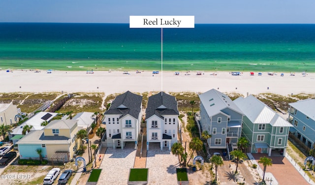 aerial view featuring a view of the beach and a water view