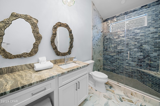 bathroom with vanity, walk in shower, tile patterned flooring, and toilet