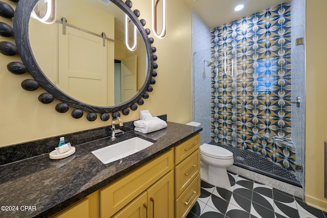 bathroom featuring vanity, toilet, and tile patterned floors