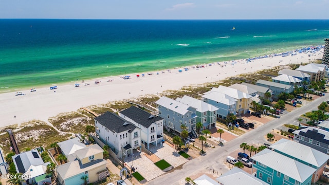 bird's eye view with a water view and a view of the beach