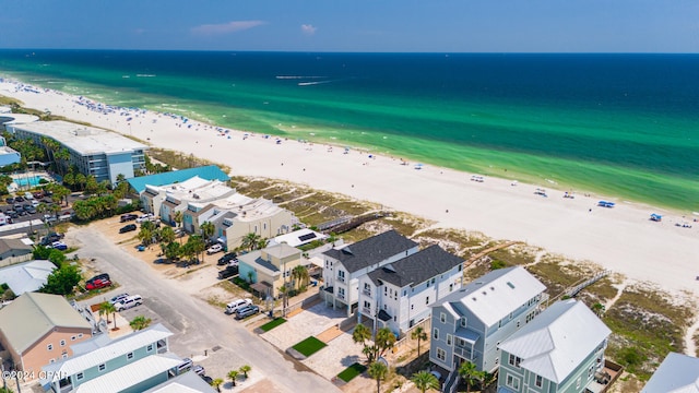 aerial view featuring a view of the beach and a water view