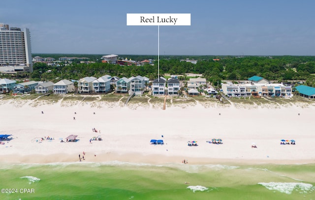 drone / aerial view featuring a beach view