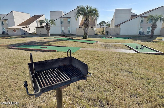 view of property's community with a lawn