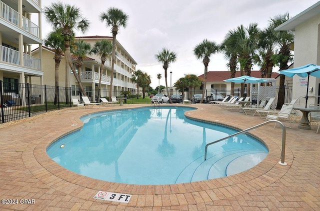 view of swimming pool with a patio