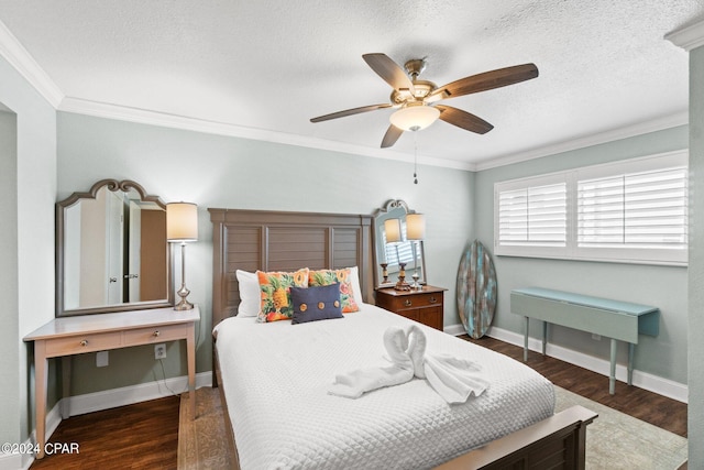 bedroom with a textured ceiling, ornamental molding, dark wood-type flooring, and ceiling fan