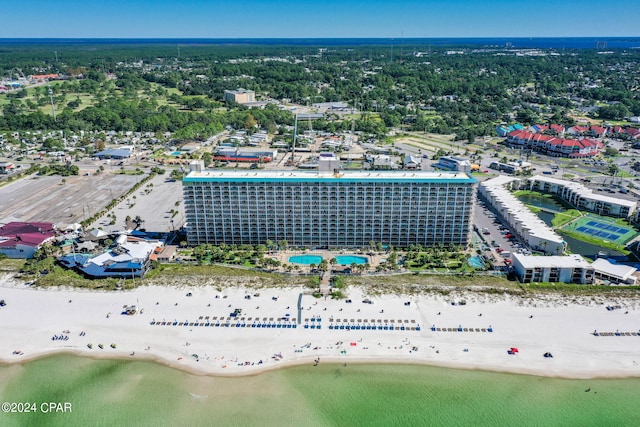 drone / aerial view featuring a water view and a view of the beach