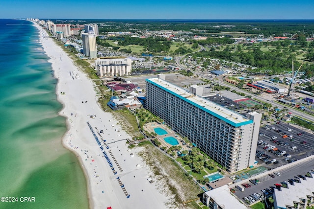 birds eye view of property with a beach view and a water view