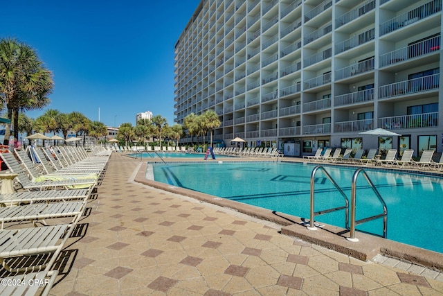 view of swimming pool with a patio