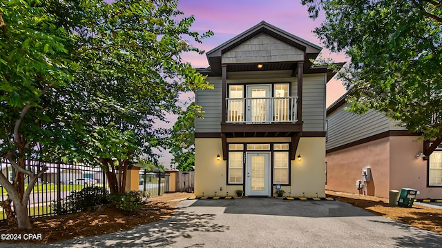 view of front of home featuring a balcony