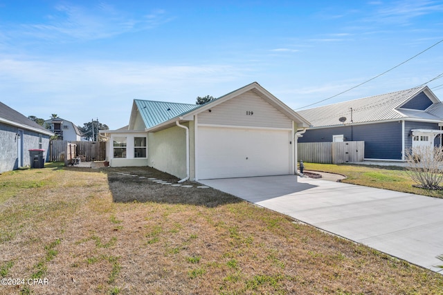 exterior space with a lawn and a garage