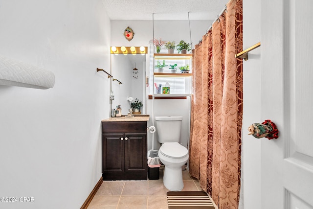 bathroom with vanity, a textured ceiling, tile patterned floors, toilet, and a shower with shower curtain