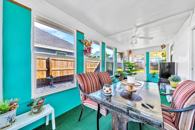 sunroom featuring ceiling fan