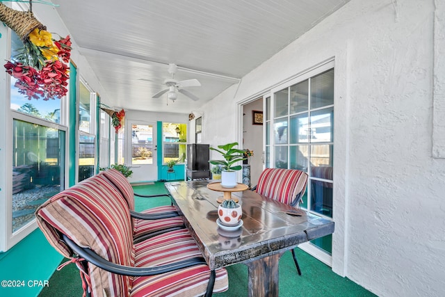 sunroom / solarium with ceiling fan