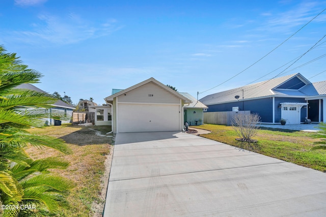 ranch-style home with a front yard and a garage