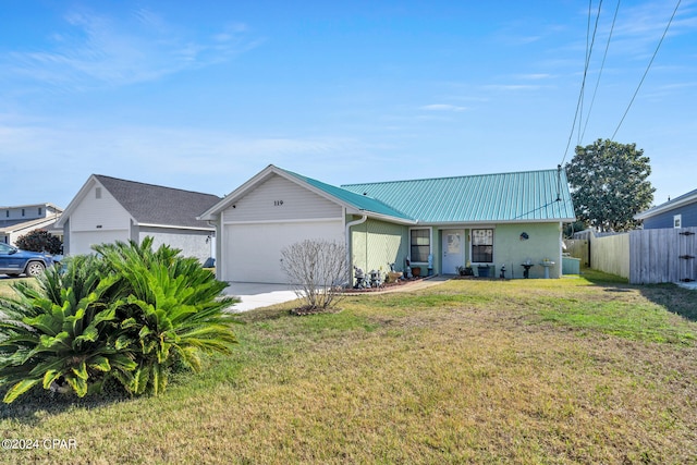 single story home featuring a front lawn and a garage