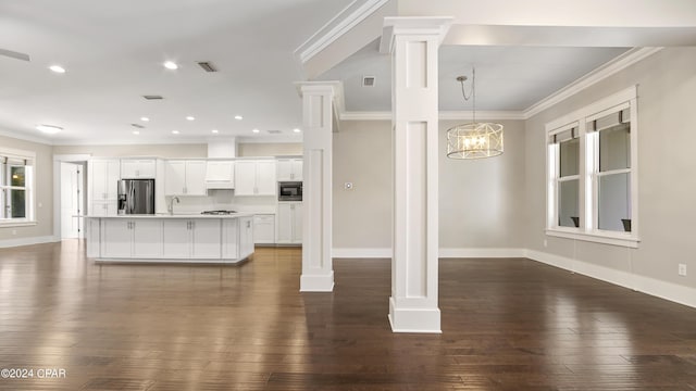 unfurnished living room featuring hardwood / wood-style floors and ornamental molding
