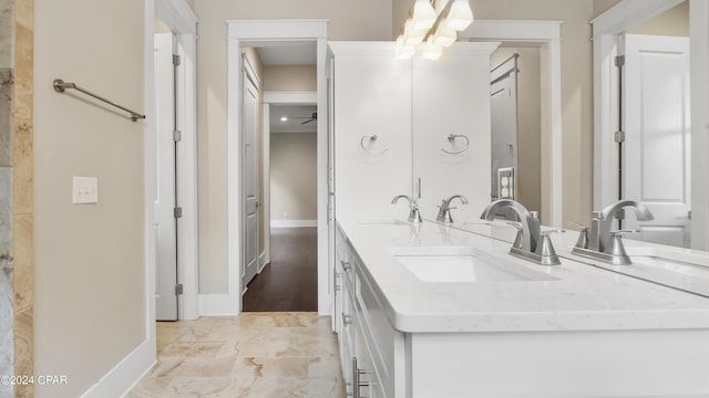 bathroom with hardwood / wood-style flooring and double vanity