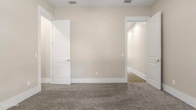unfurnished bedroom featuring light colored carpet