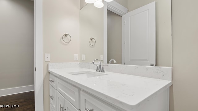 bathroom featuring vanity and wood-type flooring
