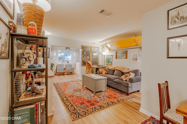 living room with light hardwood / wood-style flooring