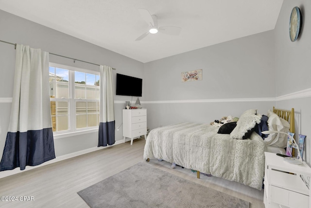 bedroom featuring light hardwood / wood-style floors and ceiling fan