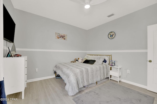 bedroom with ceiling fan and wood-type flooring