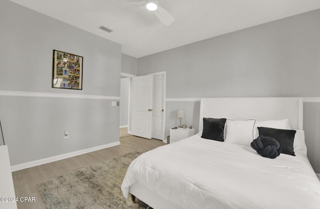 bedroom featuring ceiling fan and light hardwood / wood-style floors