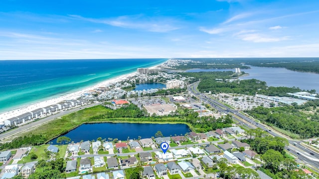 drone / aerial view featuring a view of the beach and a water view