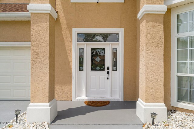 property entrance with a garage